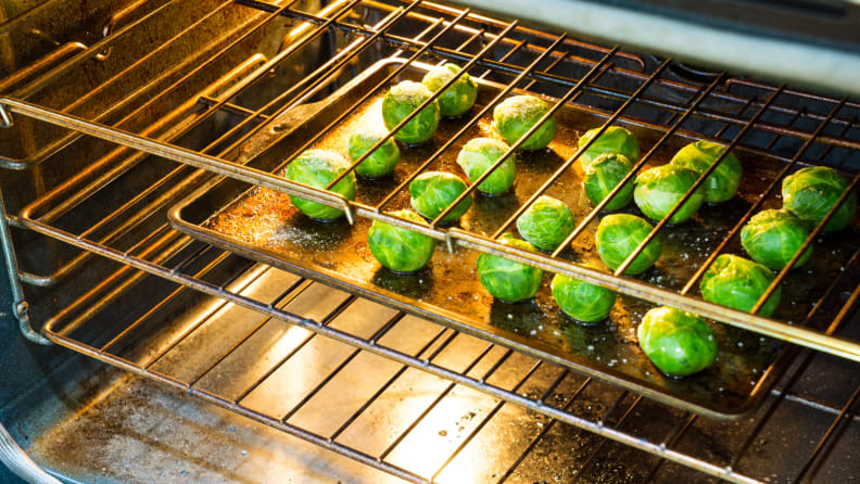 Why You Should Always Place A Baking Sheet Under Food In The Oven