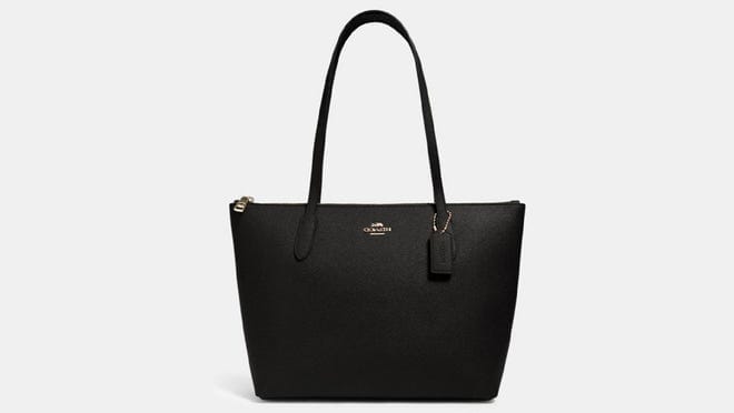 A black Coach shoulder bag.