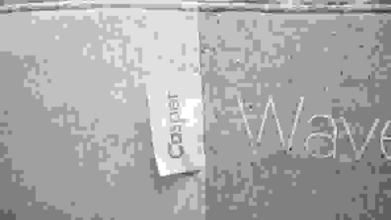 Side of a mattress with the Casper logo tag zoomed in