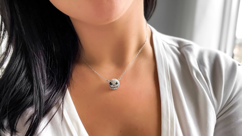 A woman wearing a studded Jack Skellington necklace