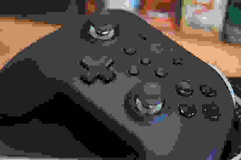 The black Gulikit KingKong 2 Pro Wireless controller up close featuring buttons and joysticks.