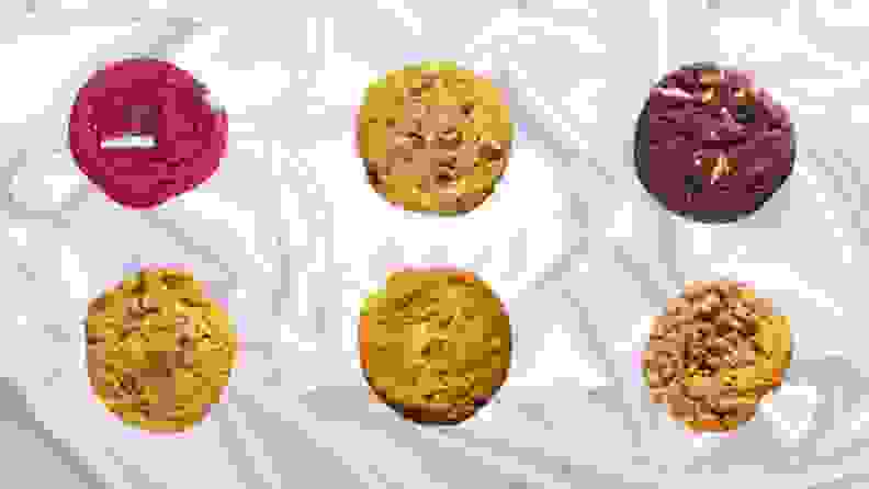 An assortment of cookies arranged in a pattern against a white background.