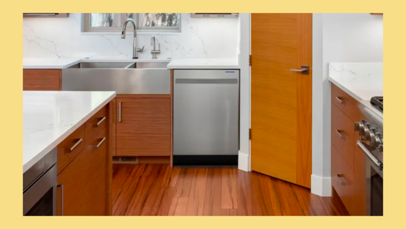 Stainless steel Sharp SDW6757ES dishwasher in modern kitchen setting.