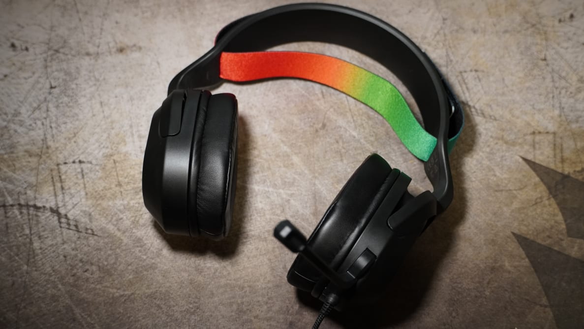 The JLab Nightfall gaming headset with a rainbow-colored ban on the top of the headphones.