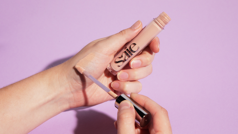 Hydrabeam Concealer being applied to a hand.