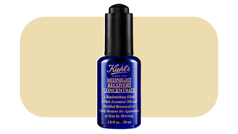 Kiehl's face oil in front of a mustard-tinted background.