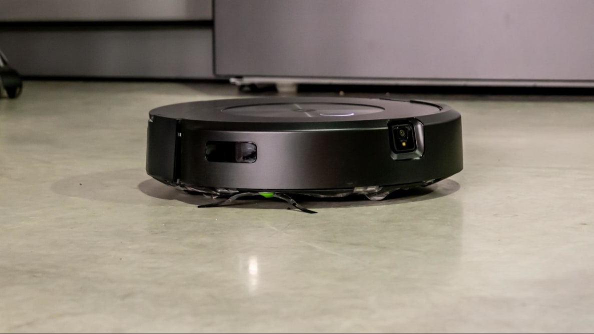 The iRobot j7+ Combo robot vacuum cleans a kitchen floor.