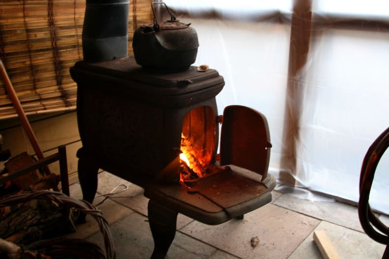 A classic wood-burning stove with stovetop