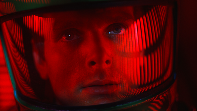 Keir Dullea stars as David Bowman (pictured in close-up wearing a spacesuit) in 2001: A Space Odyssey.