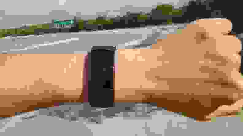 Fitbit Charge 4 on a wrist outdoors