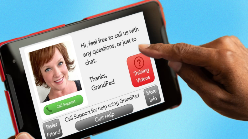 Person user finger on Grandpad tablet in order to contact technical support.