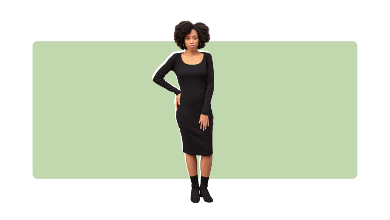 A form-fitting black dress with a scoop neck and long sleeves.