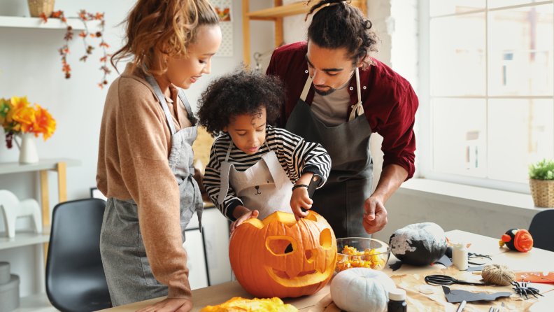 Family carving pumpkin