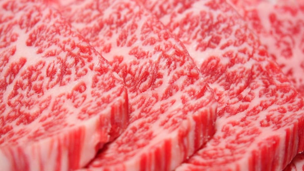 An extreme closeup photo of Japanese wagyu beef, known for its extreme marbling.