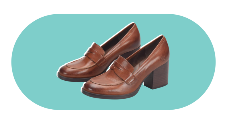 A pair of penny loafers in brown with a chunky heel.