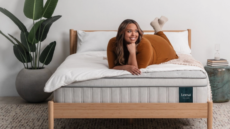 Photo of woman laying on a Leesa mattress.