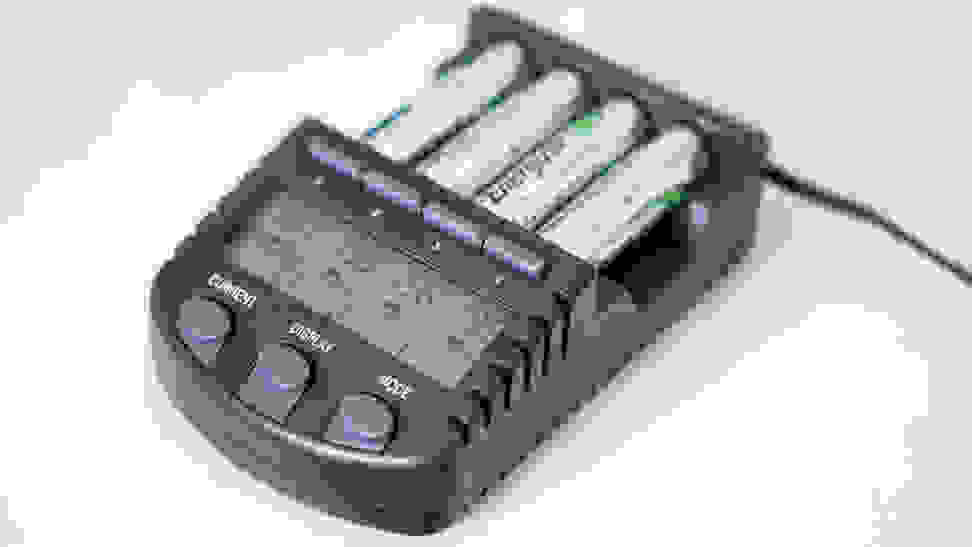 Four batteries in a black battery charger.