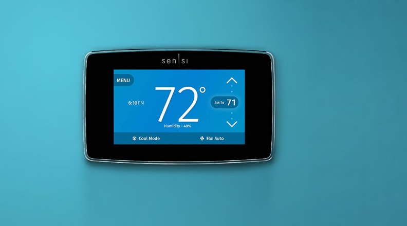 Sensi smart thermostat on a blue wall.