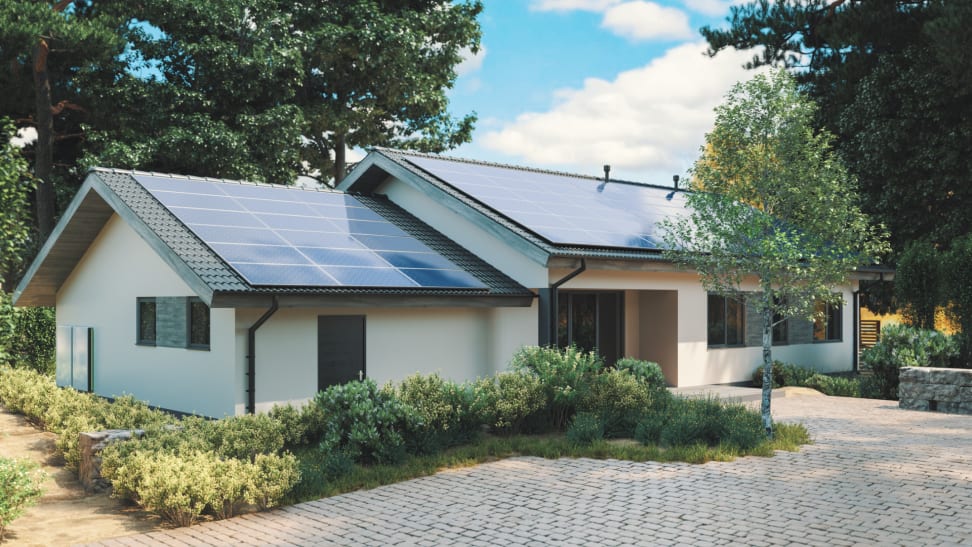 Suburban home with solar panels on roof.