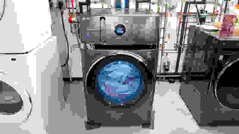 The GE PFQ97HSPVDS Washer sits in a lab environment