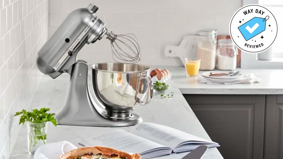 The KitchenAid Artisan Series 5-Quart Tilt-Head Stand Mixer with the Way Day Reviewed badge in a kitchen setup.