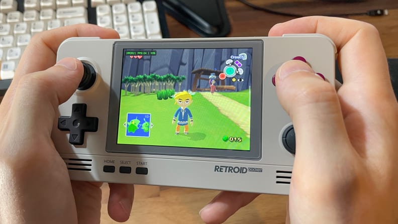 Two hands hold the Retroid Pocket 2+ while playing The Legend of Zelda: The Wind Waker.