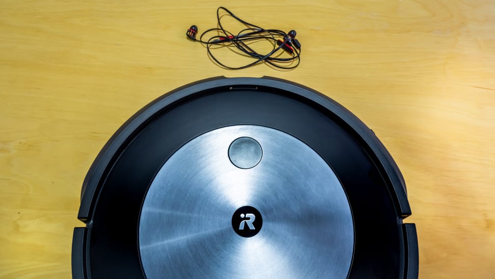 The iRobot Roomba j7+ and a pair of wired headphones