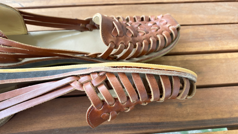 Close-up photograph of a huarache sandal where the sole is separating from the insole.