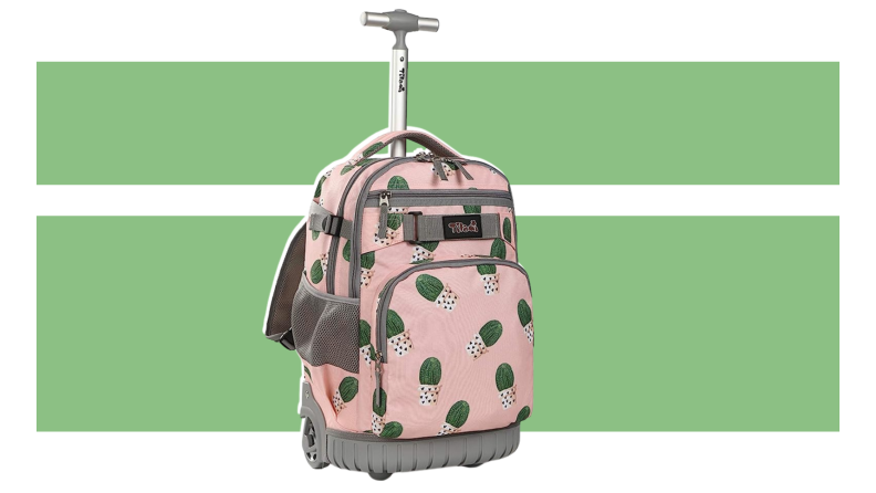 The Tilami Rolling College backpack on a green background.