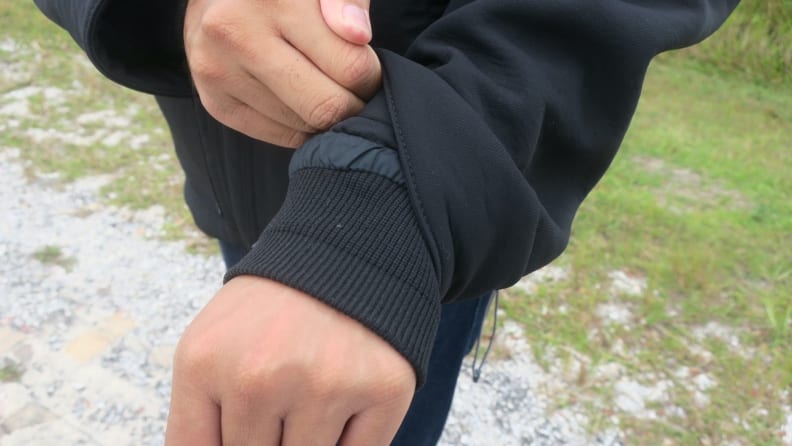 A man showing off his storm cuffs on Carhartt Super Dux jacket.