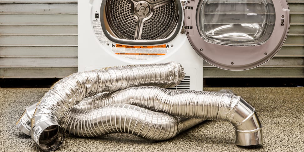 An unused exhaust duct pipe in front of a compact ventless dryer.