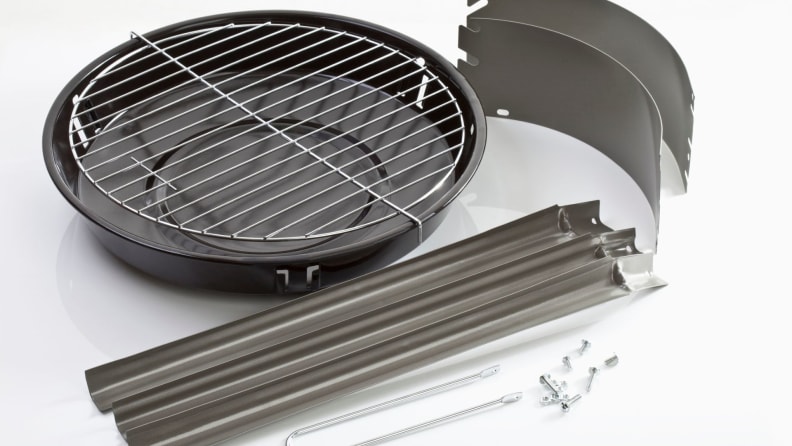 Various grill parts on a white background