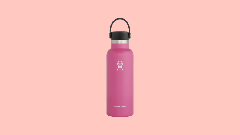 A pink A Hydro Flask water bottle shown with a black top with a small handle.