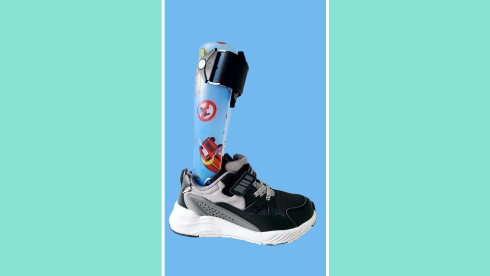 The Stride Rite kids shoe with a brace on a blue and green background.