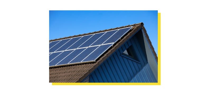 Residential home with solar panels on roof.