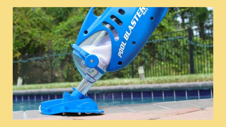The Water Tech Pool Blaster Max pool cleaner in front of an in-ground pool.