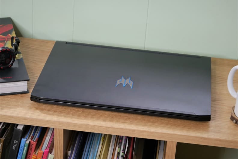 A photo of the Acer Predator Triton 300 gaming laptop closed on a bench from the front