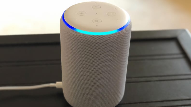 A third gen Amazon Echo speaker sits on a table