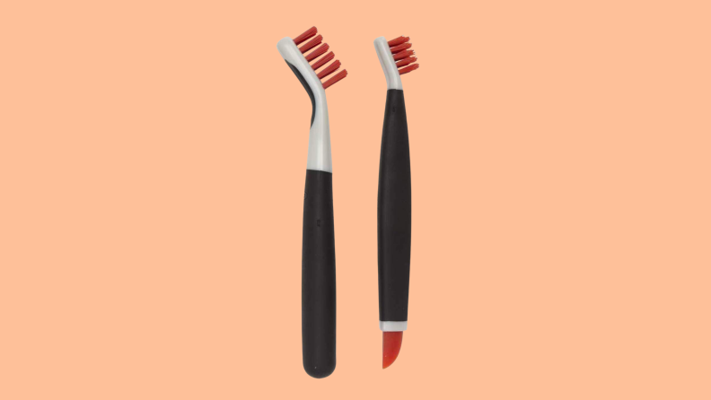 OXO cleaning brushes on a peach background