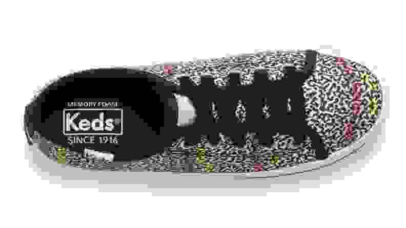 A colorful leopard print Keds shoe.