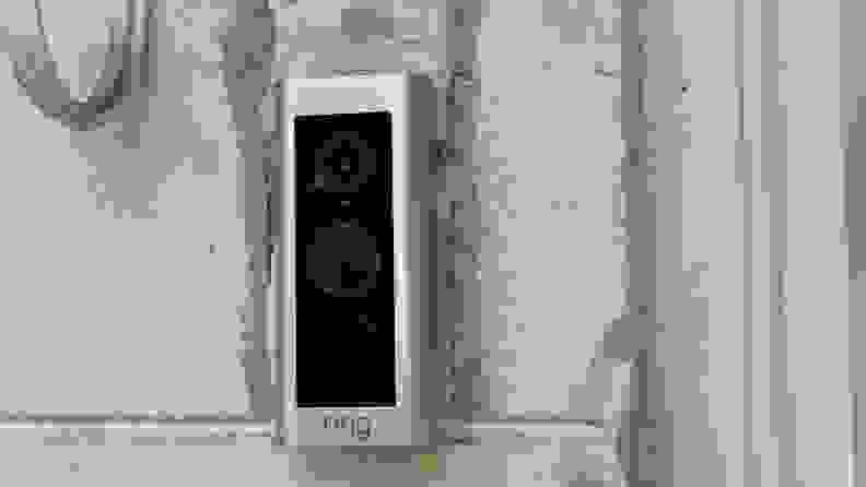 The Ring Video Doorbell Pro 2 hangs on a home.