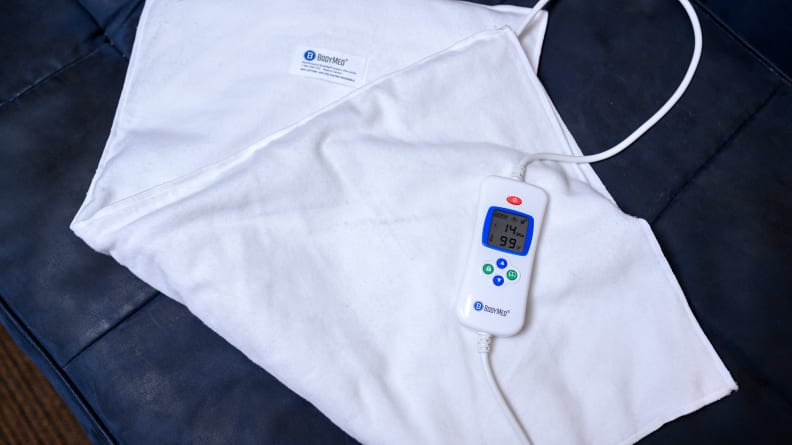 The BodyMed heating pad is powered by electricity, which heat up coils embedded in the heating pad.