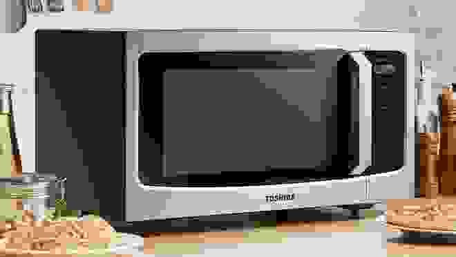 Toshiba microwave on countertop.