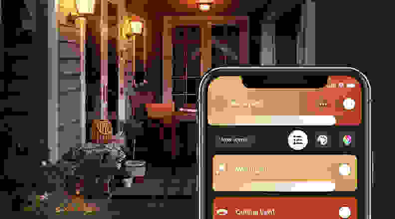 This image shows a photo of the Philips Hue mobile app controlling lights on a porch.
