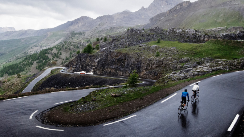 Bikers on a hilly road.