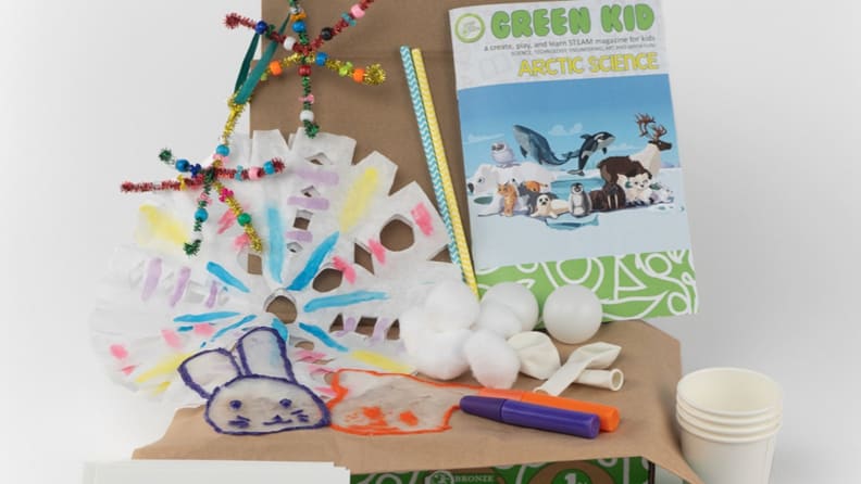 A box filled bursting with science activities for kids and a nature magazine