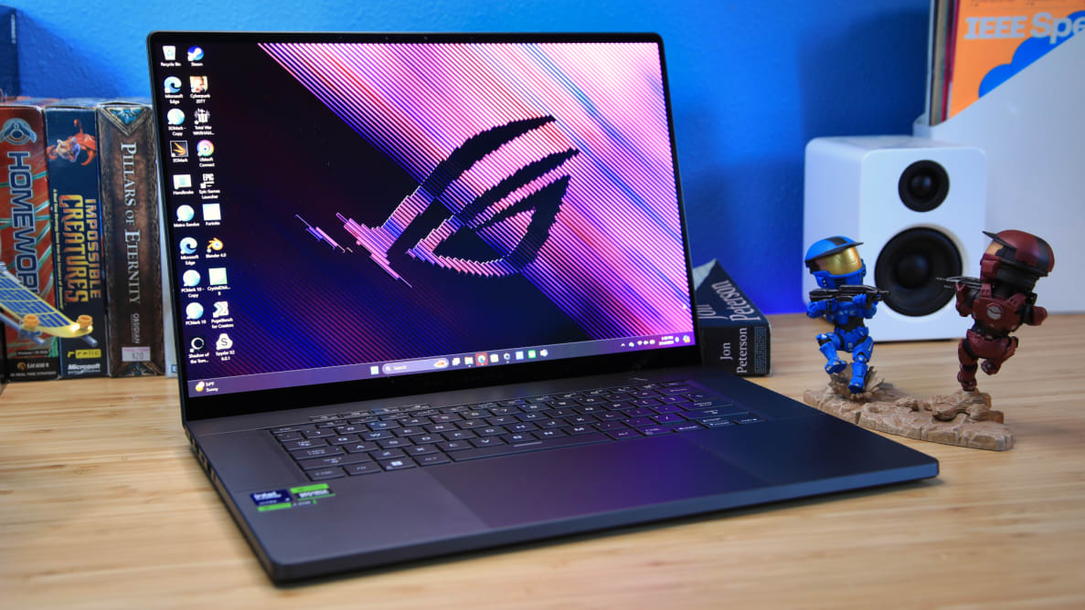 The Asus ROG Zephyrus G16 laptop on a desk.