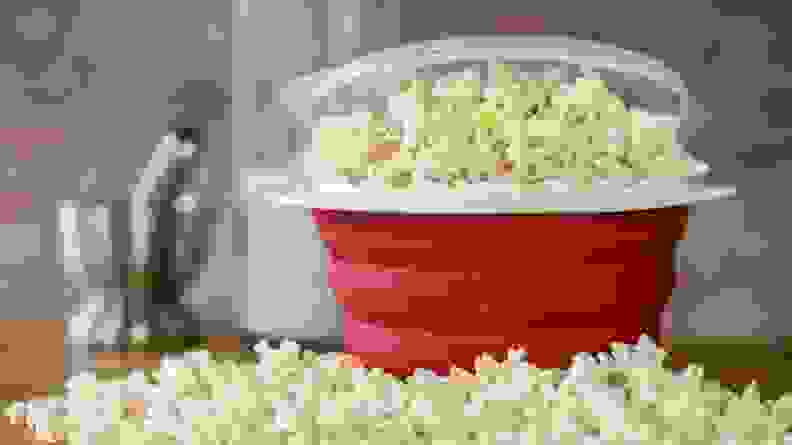 Popcorn in red bowl on countertop