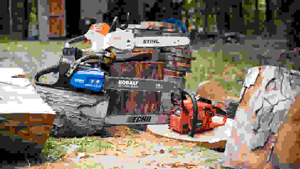 Several chainsaws displayed outdoors.