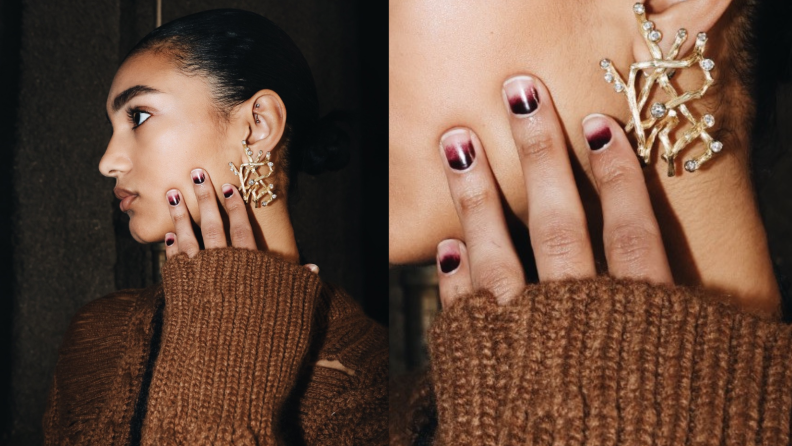 Portrait of a woman and her nails at Jason WU F/W 2024 painted in dark red nail polish.